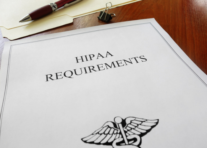 Paperwork with HIPAA Requirements printed on the first page
